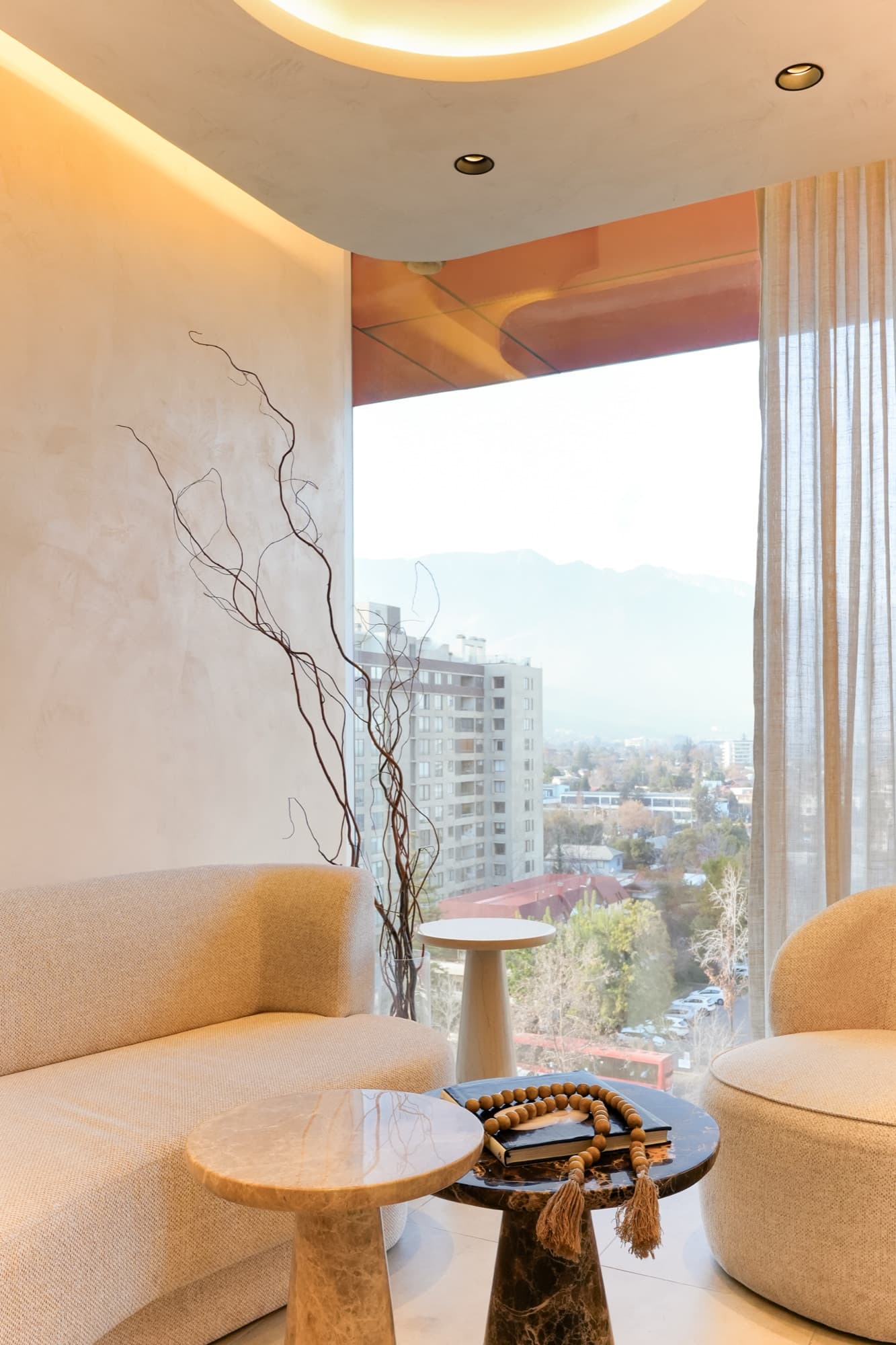 Waiting lounge corner with a view of the Andes from Vitacura